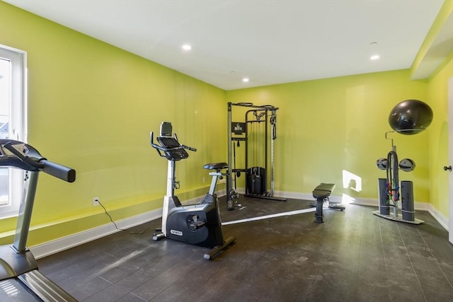 exercise area with dark hardwood / wood-style floors