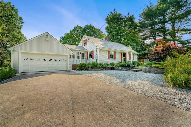 98 S Hampton Rd, Amesbury, MA 01913 - view of front of house with asphalt driveway, a garage, and board and batten siding