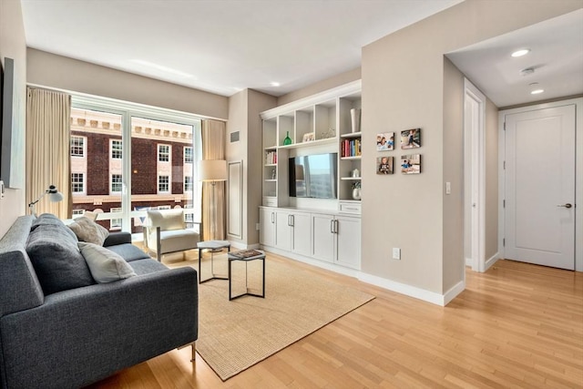 400 Stuart St Unit 15G, Boston, MA 02116 - living room with light wood-style flooring, baseboards, and recessed lighting