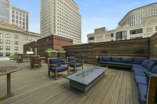 400 Stuart St Unit 15G, Boston, MA 02116 - wooden terrace with an outdoor living space with a fire pit
