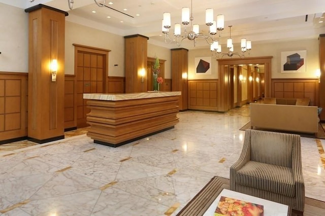 400 Stuart St Unit 15G, Boston, MA 02116 - reception featuring wainscoting, a decorative wall, a chandelier, and recessed lighting