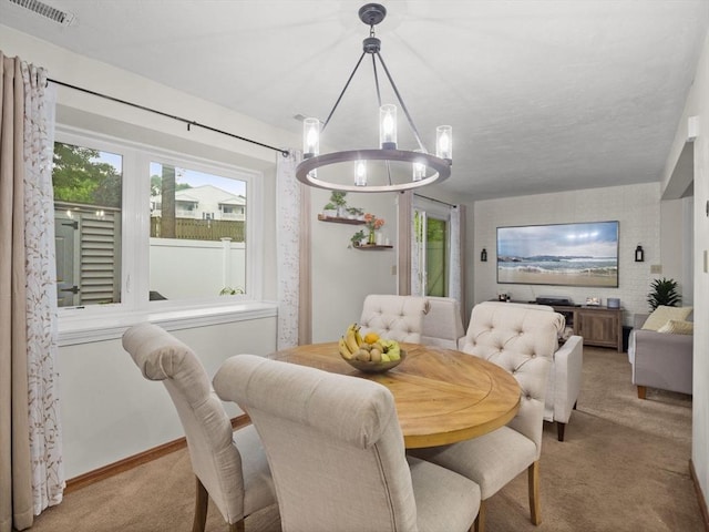 49 Meadow Pond Dr Unit I, Leominster, MA 01453 - dining room featuring carpet flooring, a chandelier, and healthy amount of natural light