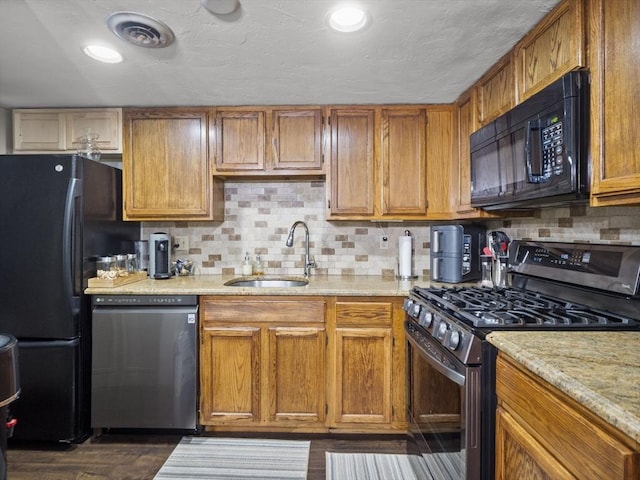 49 Meadow Pond Dr Unit I, Leominster, MA 01453 - kitchen with black appliances, backsplash, light stone countertops, and brown cabinets