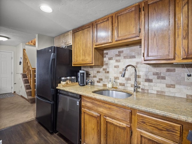 49 Meadow Pond Dr Unit I, Leominster, MA 01453 - kitchen featuring dishwashing machine, brown cabinetry, decorative backsplash, and light stone counters