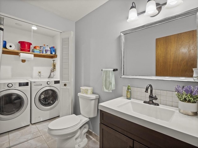 49 Meadow Pond Dr Unit I, Leominster, MA 01453 - bathroom with washing machine and dryer, vanity, tasteful backsplash, and tile patterned flooring