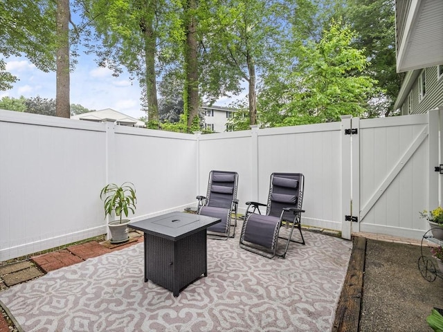 49 Meadow Pond Dr Unit I, Leominster, MA 01453 - fenced backyard with a gate and a patio area