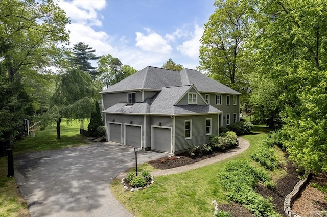 27 Bowker Dr, Sudbury, MA 01776 - view of front of home featuring driveway, roof with shingles, and a front yard