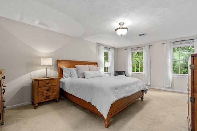 27 Bowker Dr, Sudbury, MA 01776 - bedroom with baseboards and light carpet
