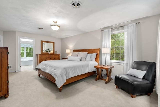 27 Bowker Dr, Sudbury, MA 01776 - bedroom featuring multiple windows, light carpet, and baseboards