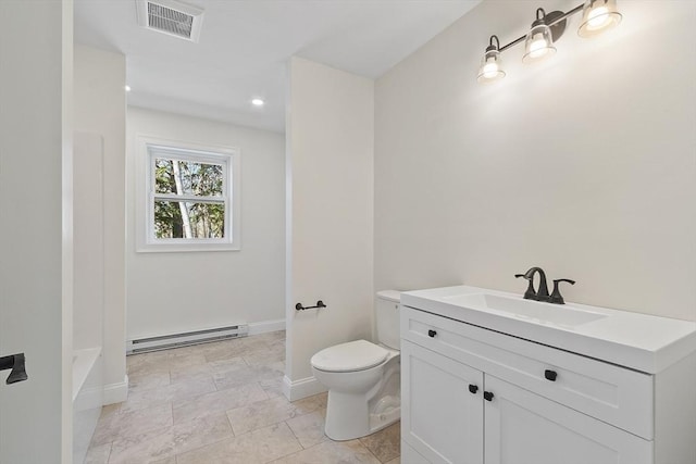 bathroom with toilet, visible vents, baseboards, baseboard heating, and vanity