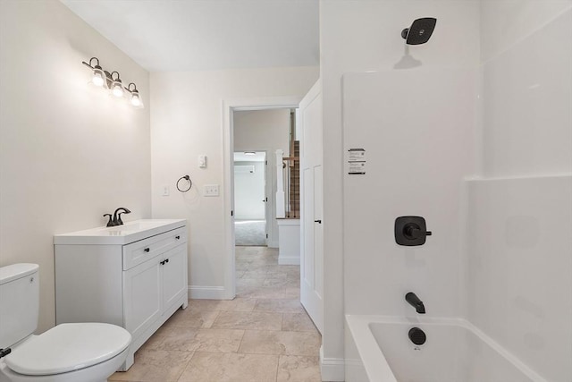 full bath with vanity, tub / shower combination, baseboards, and toilet