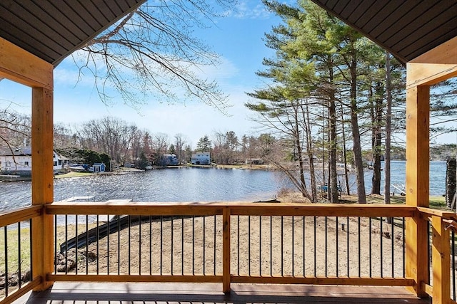 wooden deck with a water view