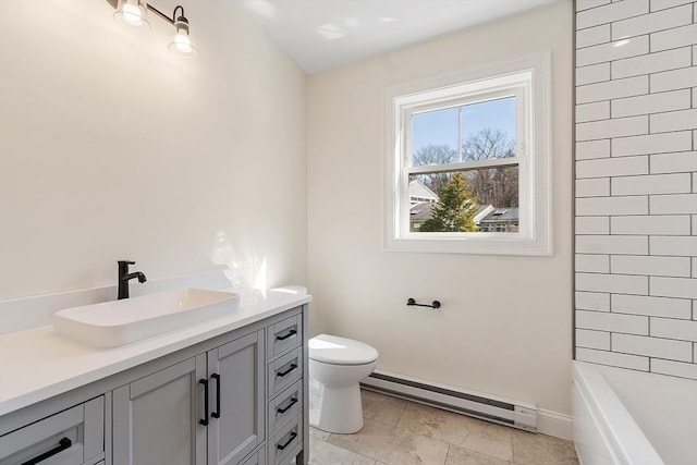 bathroom featuring toilet, a shower, a baseboard heating unit, vanity, and tile patterned flooring