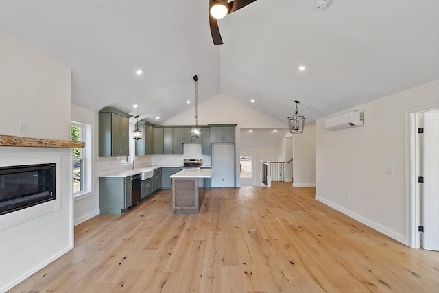 kitchen featuring lofted ceiling, an AC wall unit, dishwasher, ceiling fan, and light countertops