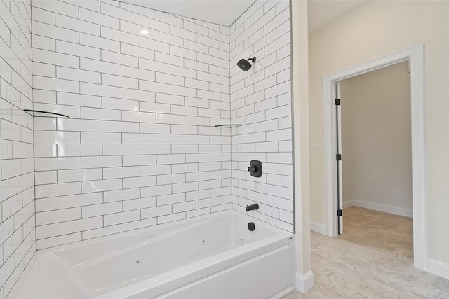 full bathroom featuring a combined bath / shower with jetted tub and baseboards
