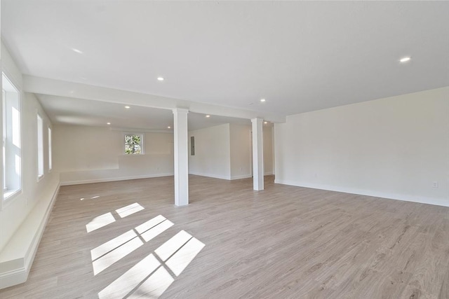 interior space with baseboards, recessed lighting, and light wood-type flooring