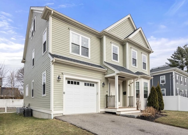 view of front facade with a front lawn and a garage