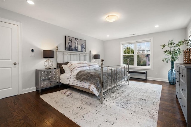 bedroom featuring dark hardwood / wood-style flooring