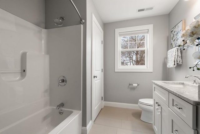 full bathroom with toilet, vanity, tile patterned flooring, and washtub / shower combination