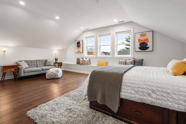 bedroom with dark wood-type flooring and lofted ceiling