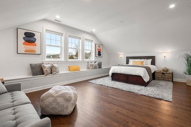 bedroom with lofted ceiling and dark hardwood / wood-style flooring