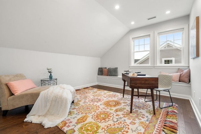 office space featuring vaulted ceiling and dark wood-type flooring