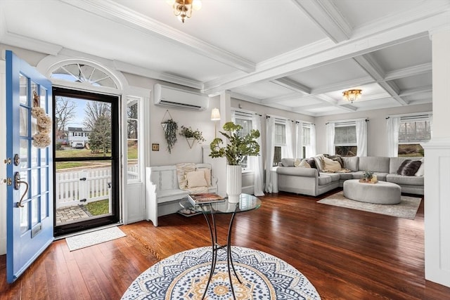 entrance foyer with hardwood / wood-style floors, a wall mounted air conditioner, beamed ceiling, and plenty of natural light