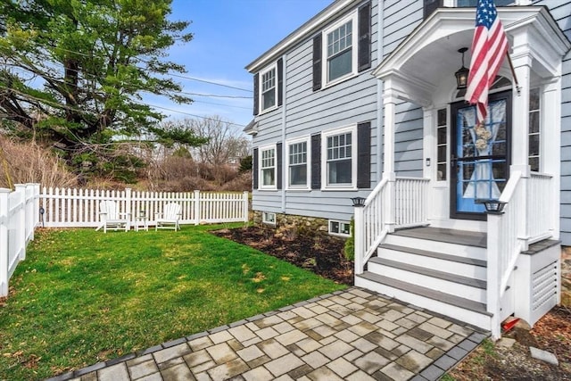 exterior space with a yard and fence