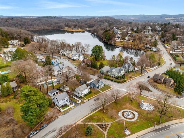 birds eye view of property with a water view and a residential view