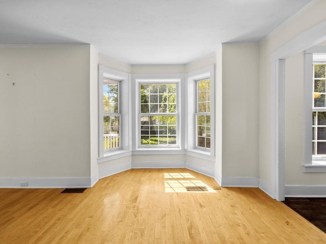 14 Parkman St, Westborough, MA 01581 - empty room with baseboards, wood finished floors, and ornamental molding