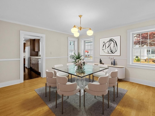 14 Parkman St, Westborough, MA 01581 - dining room featuring a chandelier, light wood finished floors, ornamental molding, and baseboards