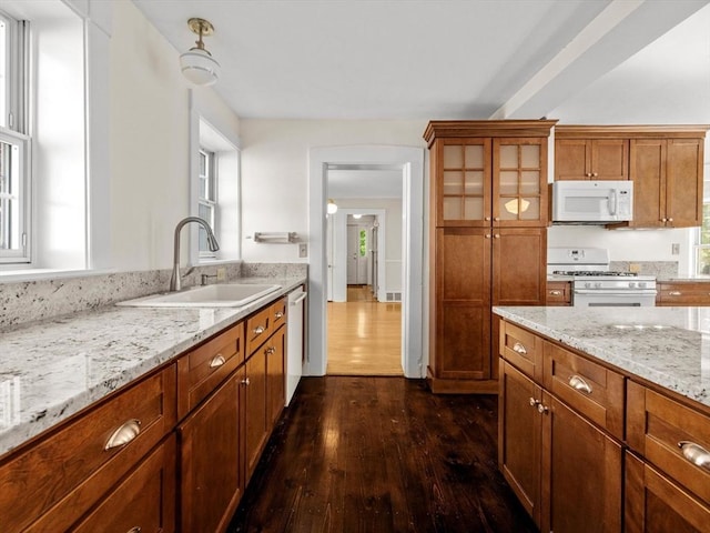 14 Parkman St, Westborough, MA 01581 - kitchen featuring white appliances, a sink, dark wood-style floors, and brown cabinetry