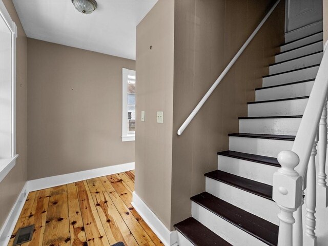 14 Parkman St, Westborough, MA 01581 - staircase with hardwood / wood-style floors and baseboards