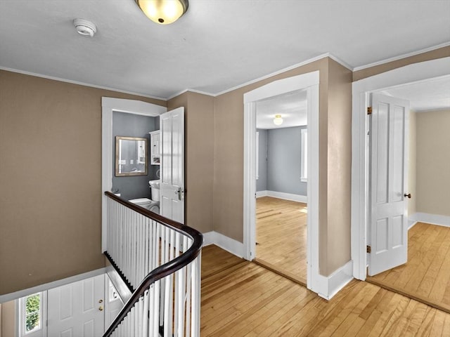 14 Parkman St, Westborough, MA 01581 - hallway with light wood-style flooring, an upstairs landing, ornamental molding, and baseboards