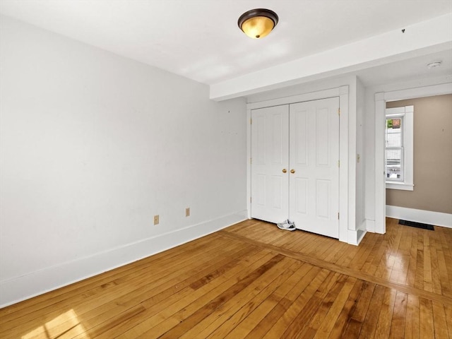 14 Parkman St, Westborough, MA 01581 - unfurnished bedroom with hardwood / wood-style flooring, baseboards, and a closet