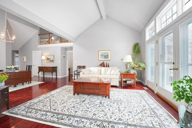 living room with an inviting chandelier, dark hardwood / wood-style flooring, high vaulted ceiling, and beamed ceiling