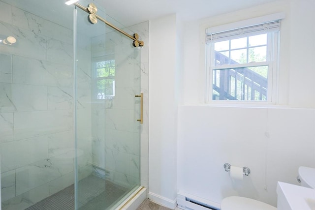 bathroom featuring toilet, a marble finish shower, healthy amount of natural light, and a baseboard radiator