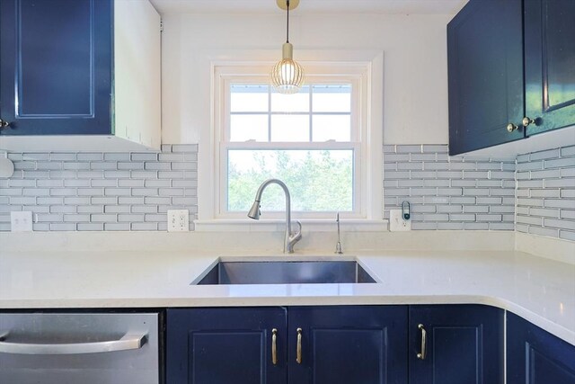 kitchen featuring a sink, blue cabinetry, stainless steel dishwasher, and decorative backsplash