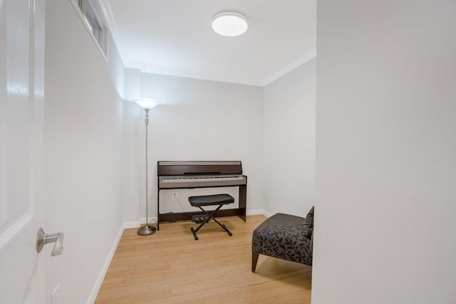 misc room with hardwood / wood-style flooring and ornamental molding