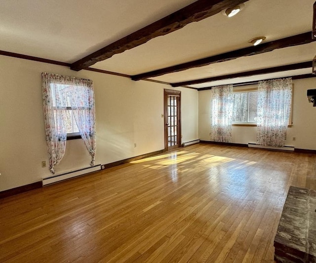 unfurnished room featuring hardwood / wood-style flooring, a baseboard heating unit, and beamed ceiling