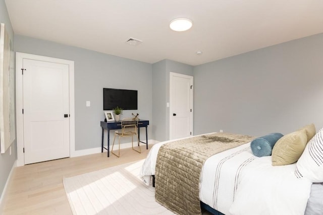 bedroom with light hardwood / wood-style flooring