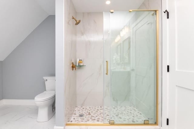 bathroom with lofted ceiling, toilet, and walk in shower