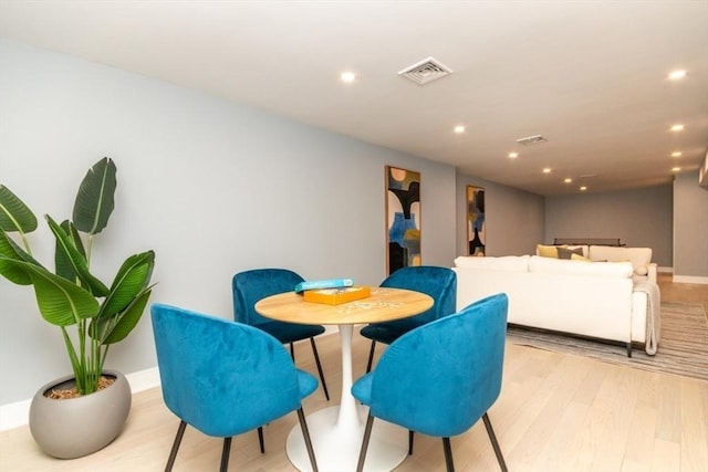 dining area with light hardwood / wood-style flooring