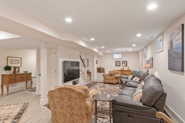 living area with stairs, recessed lighting, baseboards, and light wood-style flooring
