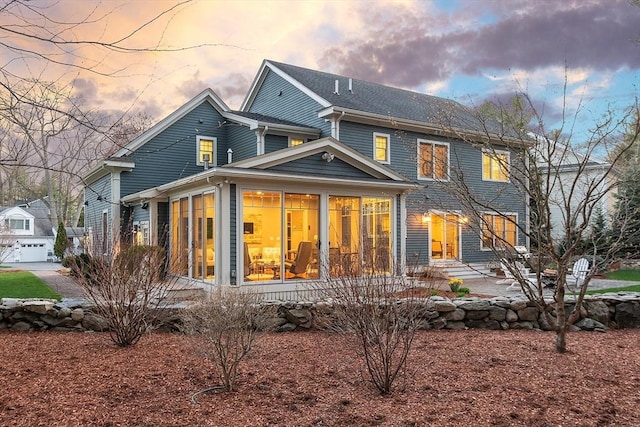 rear view of house with a sunroom