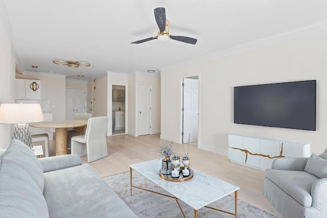 85 E India Row Unit 36D, Boston, MA 02110 - living room with ornamental molding, light wood-style floors, ceiling fan, and baseboards