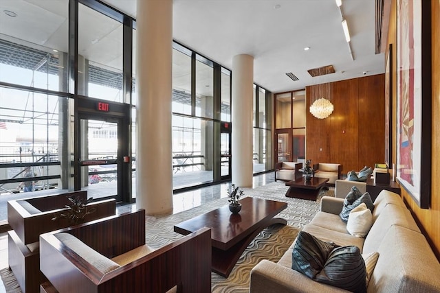 85 E India Row Unit 36D, Boston, MA 02110 - common area with expansive windows and a towering ceiling