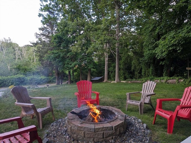 view of yard with a fire pit