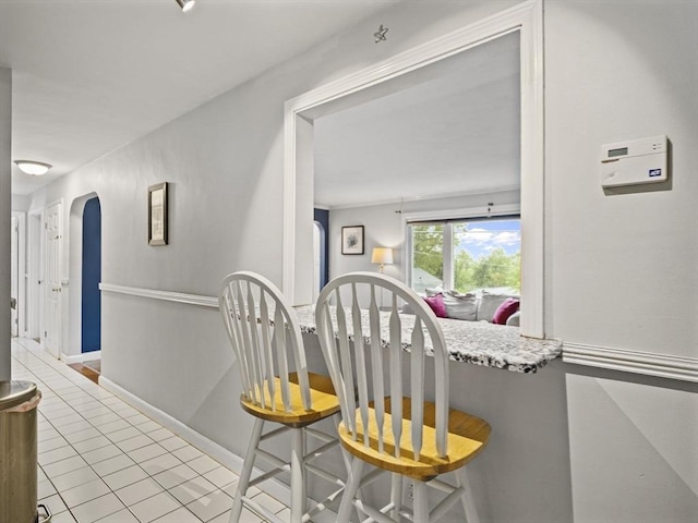 11 View St, Dracut, MA 01826 - hall featuring arched walkways, tile patterned floors, and baseboards