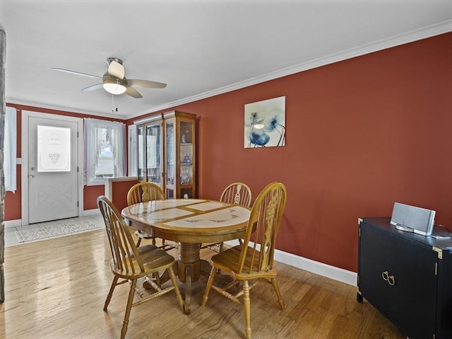 11 View St, Dracut, MA 01826 - dining area featuring light wood finished floors, baseboards, a ceiling fan, and ornamental molding